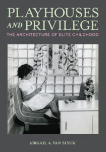 Book cover for Playhouses and Privilege: The Architecture of Elite Childhood by Abigail A. Van Slyck, featuring a black-and-white photo of a girl sitting and reading in a stylish room with glass block walls.